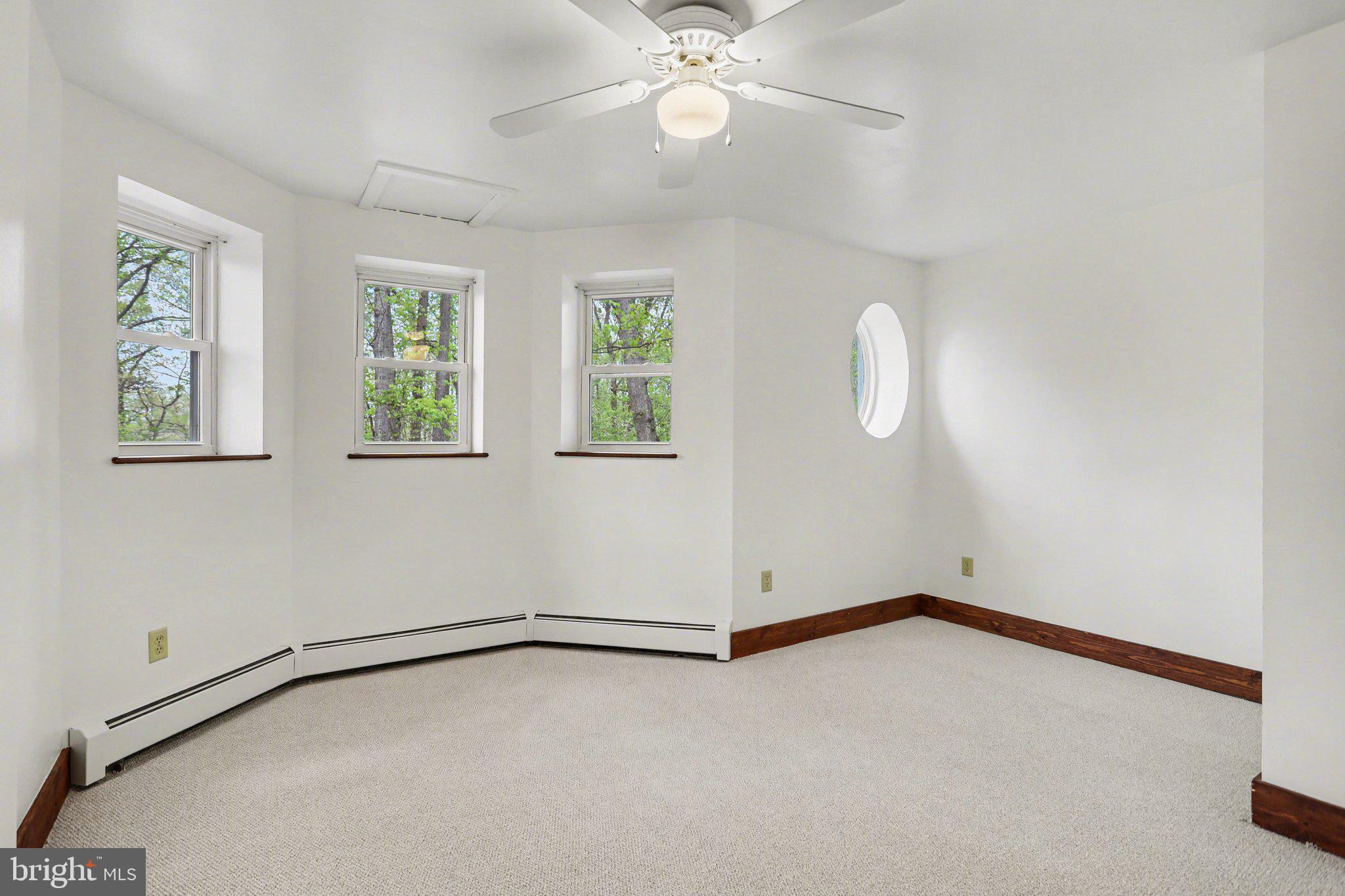 204 Bullfrog Road Gettysburg, PA 17325 - Photo 35 of 52 an empty room with windows and fan