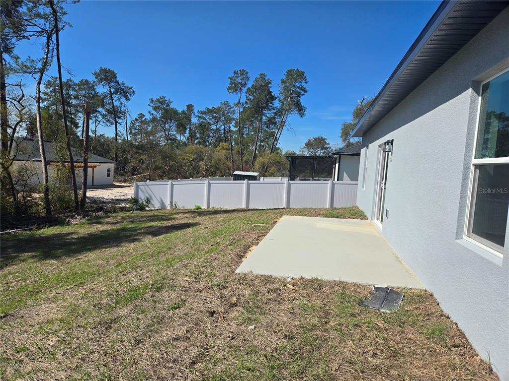 2644 Southwest 162nd Street Road Ocala, FL 34473 - Photo 5 of 47 a view of backyard with large tree