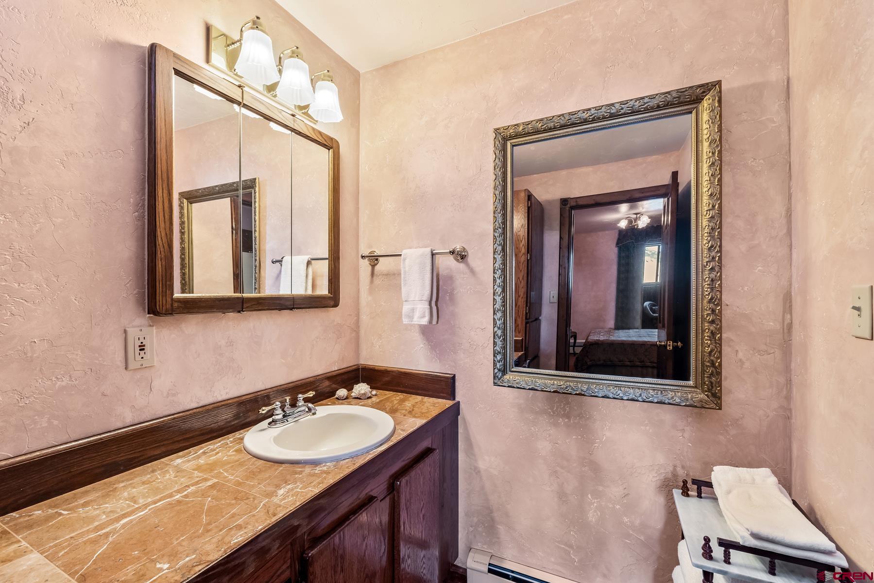 8 Gothic Avenue Crested Butte, CO 81224 - Photo 25 of 35 a bathroom with a sink vanity and a mirror