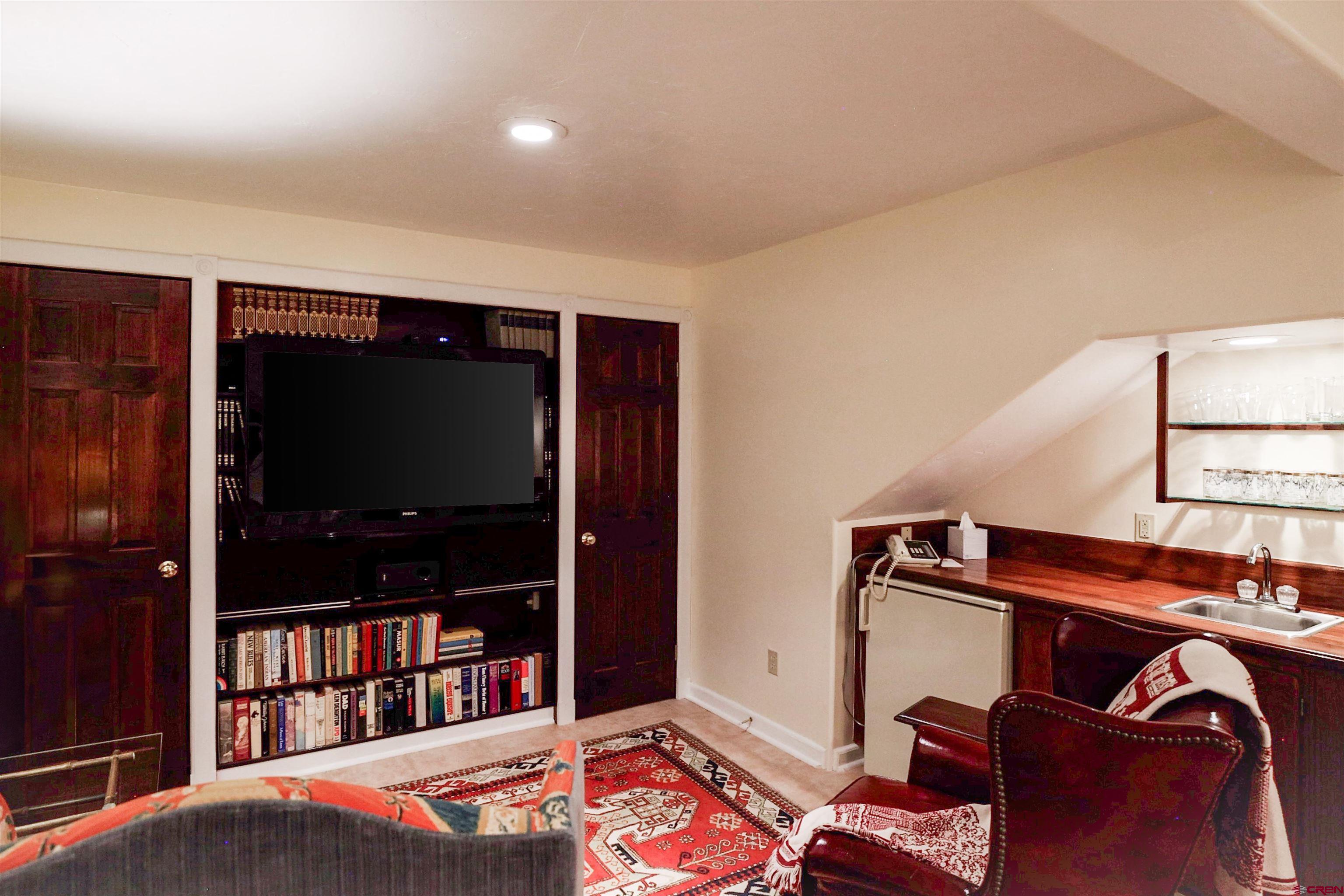 8 Gothic Avenue Crested Butte, CO 81224 - Photo 29 of 35 a living room with furniture and a flat screen tv