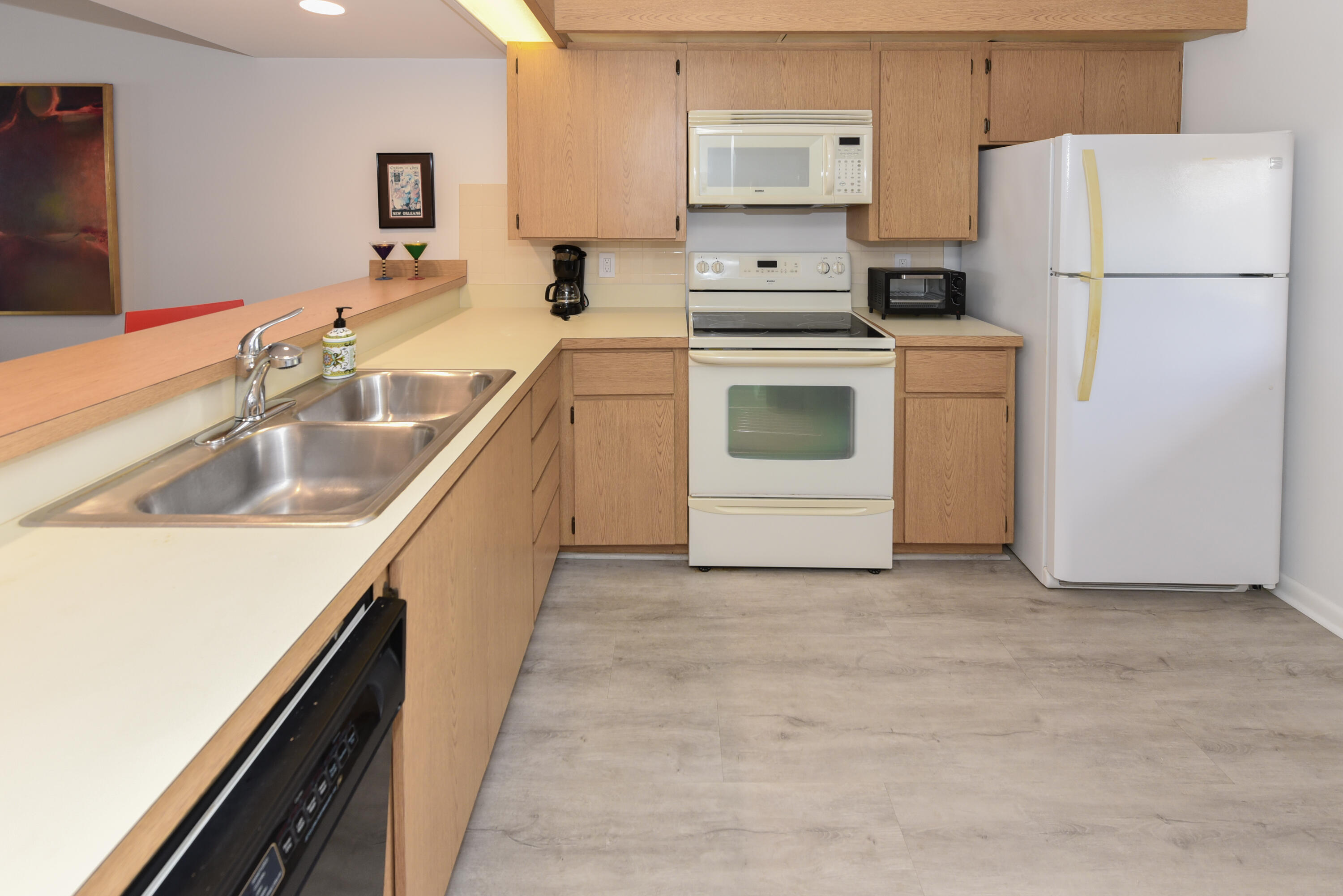 2401 Marina Isle Way, Unit 405 Jupiter, FL 33477 - Photo 11 of 30 a kitchen with a sink a stove and refrigerator