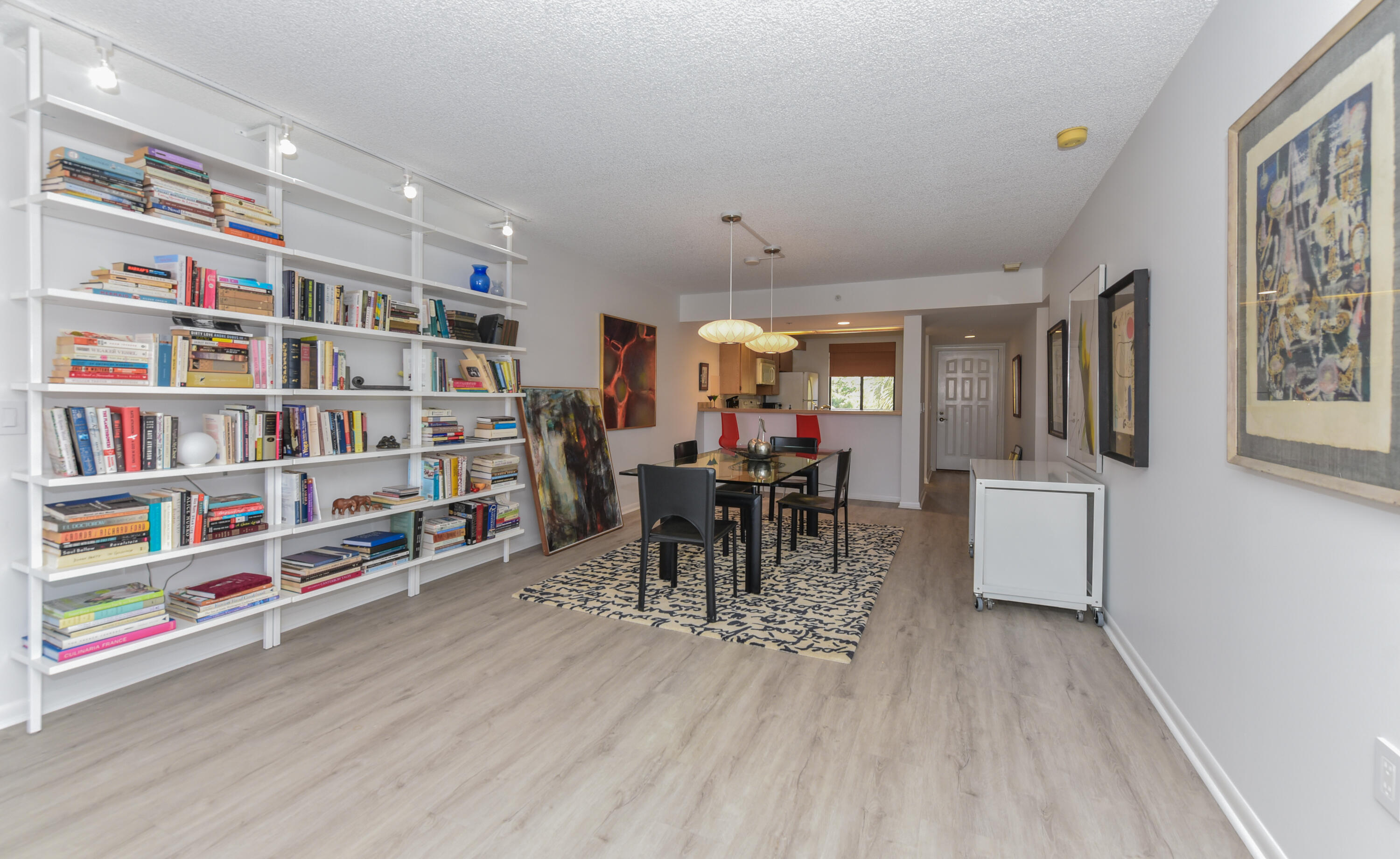 2401 Marina Isle Way, Unit 405 Jupiter, FL 33477 - Photo 16 of 30 a dining room with furniture and a book shelf