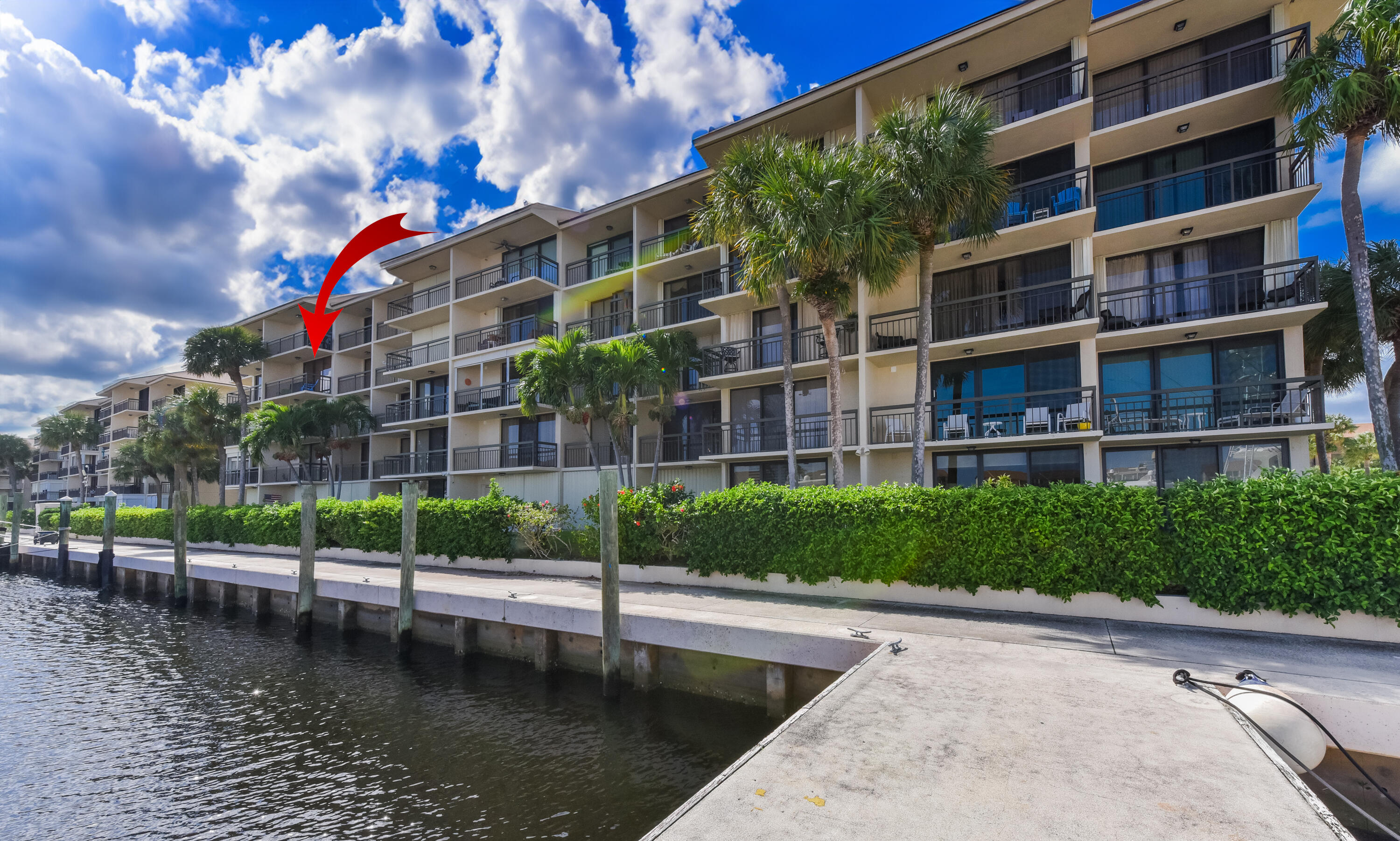 2401 Marina Isle Way, Unit 405 Jupiter, FL 33477 - Photo 2 of 30 a view of a lake with a building