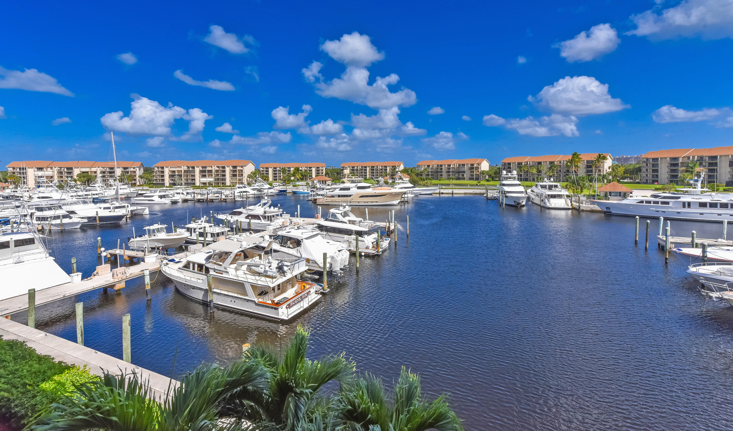 2401 Marina Isle Way, Unit 405 Jupiter, FL 33477 - Photo 23 of 30 a view of a swimming pool and an outdoor seating