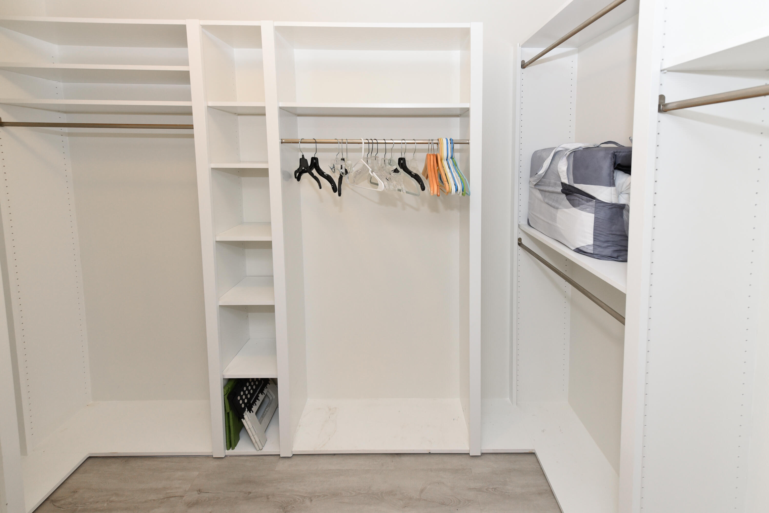 2401 Marina Isle Way, Unit 405 Jupiter, FL 33477 - Photo 27 of 30 a view of walk in closet with clothes and shoes