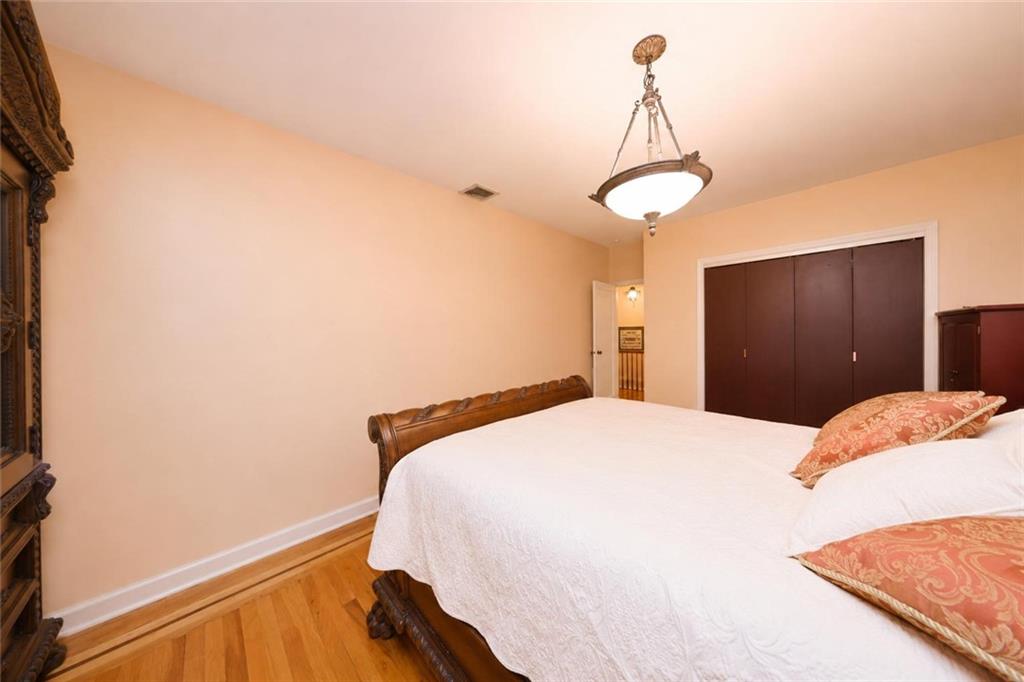 1 Bay Ridge Parkway Brooklyn, NY 11209 - Photo 19 of 38 a bedroom with a bed and cabinets