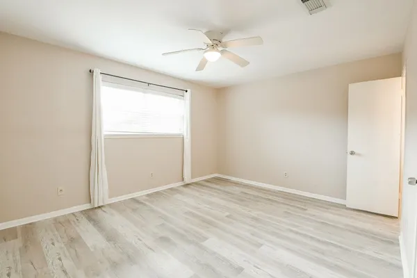 a bathroom with a granite countertop sink toilet and bathtub