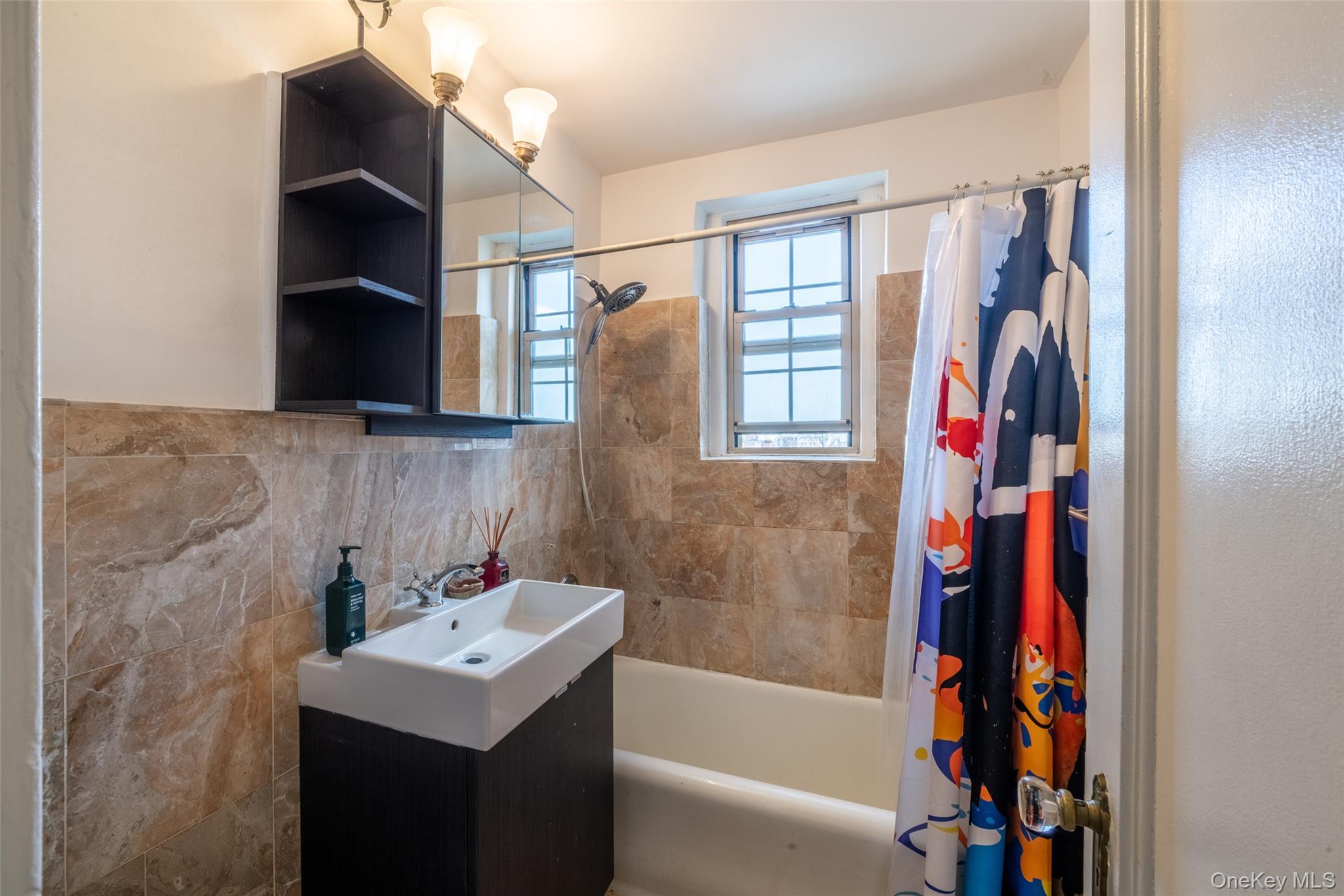 151 Centre Avenue, Unit 5B New Rochelle, NY 10805 - Photo 11 of 14 a bathroom with a bathtub and a sink