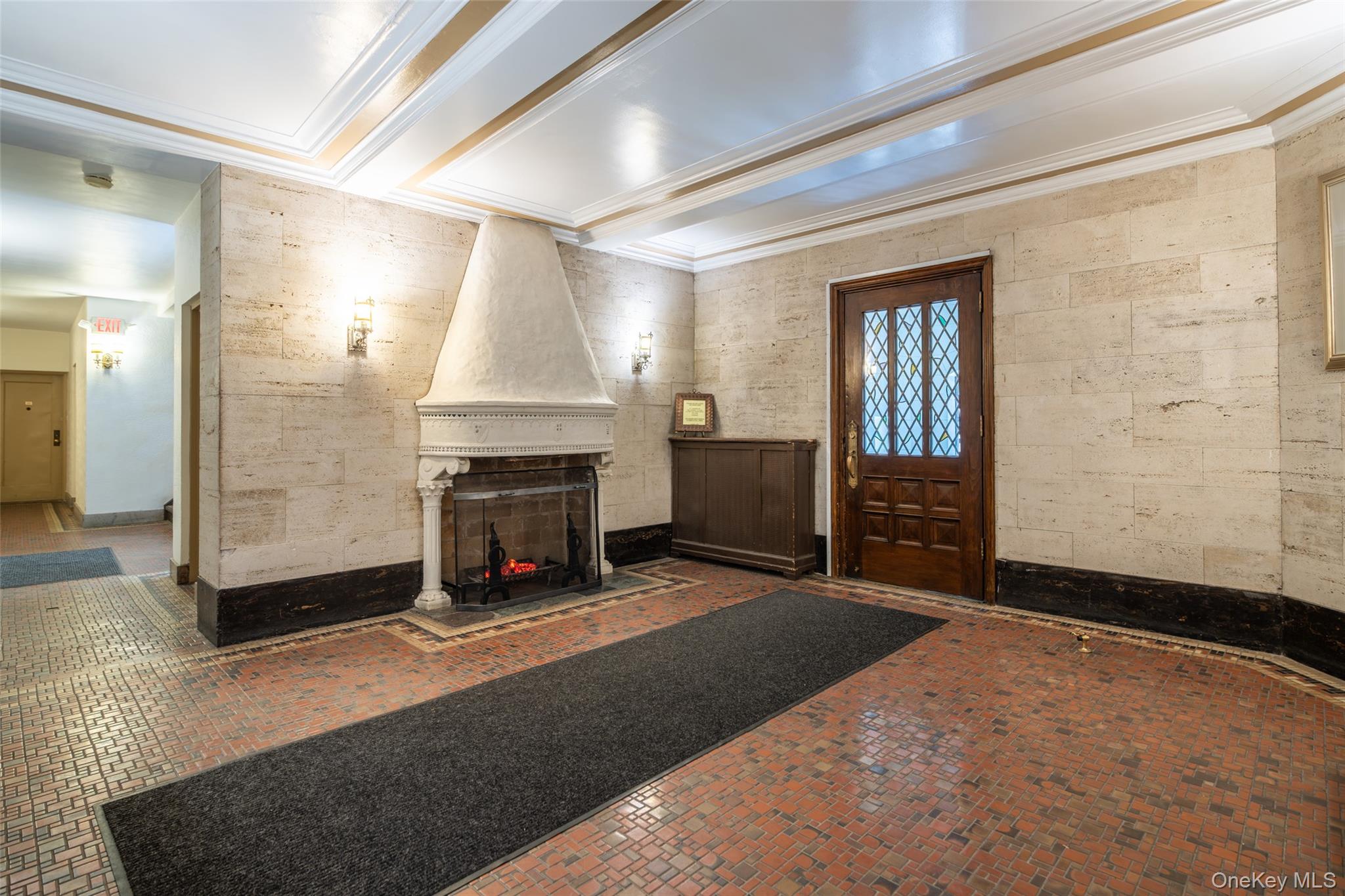 151 Centre Avenue, Unit 5B New Rochelle, NY 10805 - Photo 2 of 14 a view of an empty room with a fireplace and a window