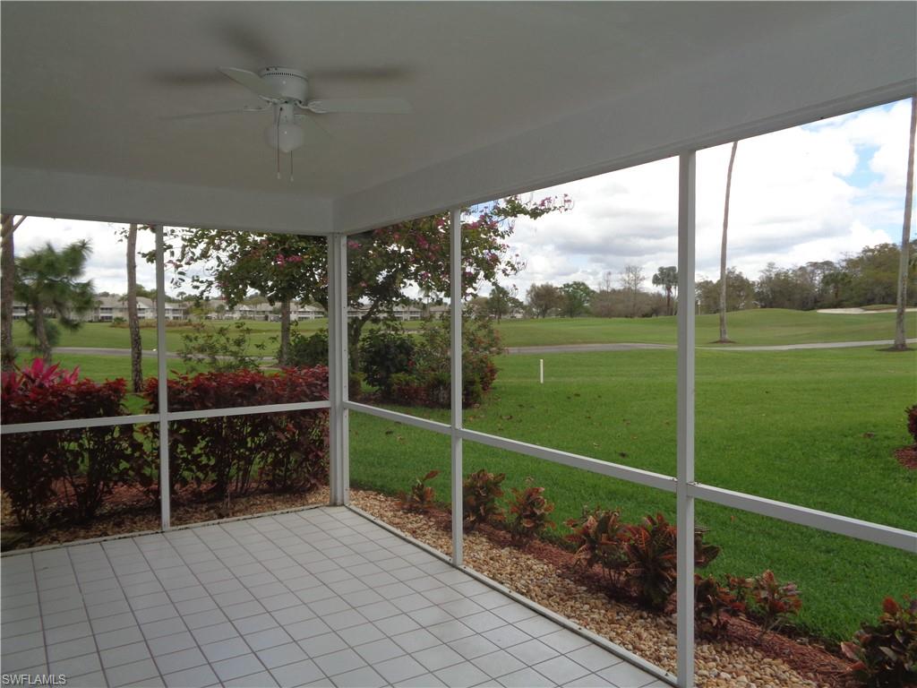 271 Perignon Place, Unit 161 Naples, FL 34119 - Photo 14 of 39 a view of a backyard