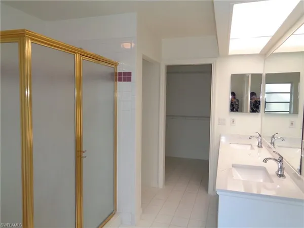 a bathroom with a sink and mirror
