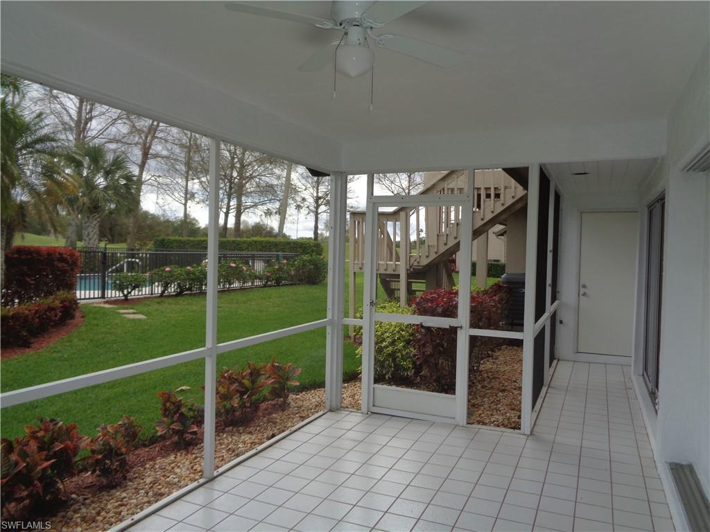 271 Perignon Place, Unit 161 Naples, FL 34119 - Photo 36 of 39 a view of a porch with furniture and garden