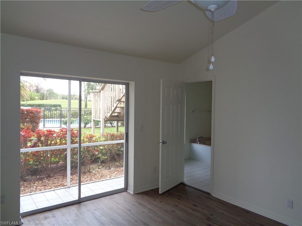 271 Perignon Place, Unit 161 Naples, FL 34119 - Photo 37 of 39 a view of a room with wooden floor and windows