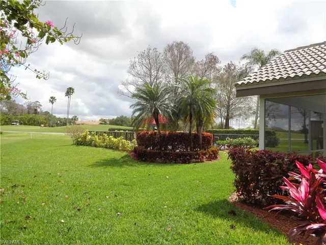 a view of a garden with an apartment