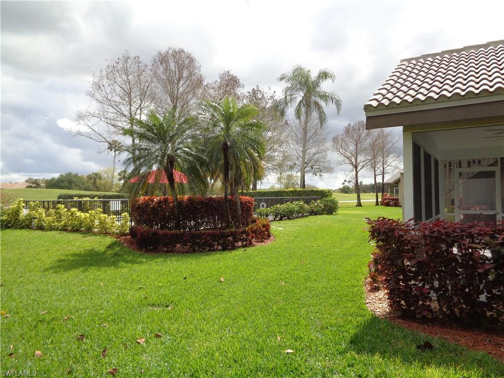 271 Perignon Place, Unit 161 Naples, FL 34119 - Photo 5 of 39 a view of a yard and front view of a house