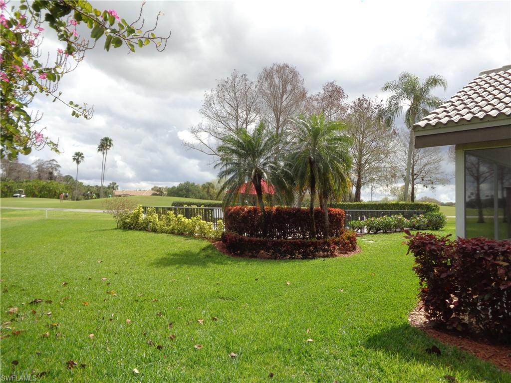 271 Perignon Place, Unit 161 Naples, FL 34119 - Photo 6 of 39 a view of a garden with an apartment