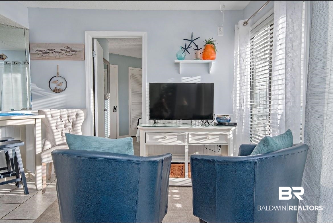 497 Plantation Road, Unit 1156 Gulf Shores, AL 36542 - Photo 9 of 28 Living area with tile patterned flooring