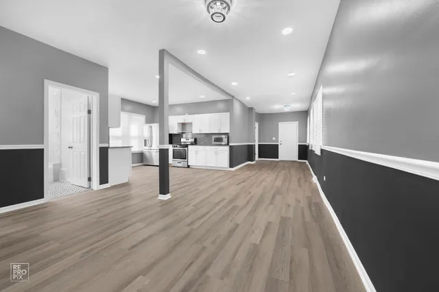 a view of kitchen with cabinets