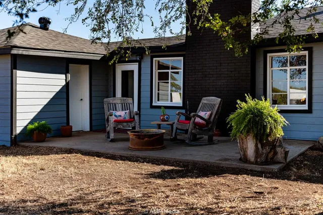 a view front of house with outdoor seating