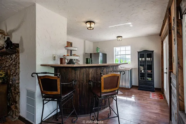 a kitchen with stainless steel appliances granite countertop a stove and a sink