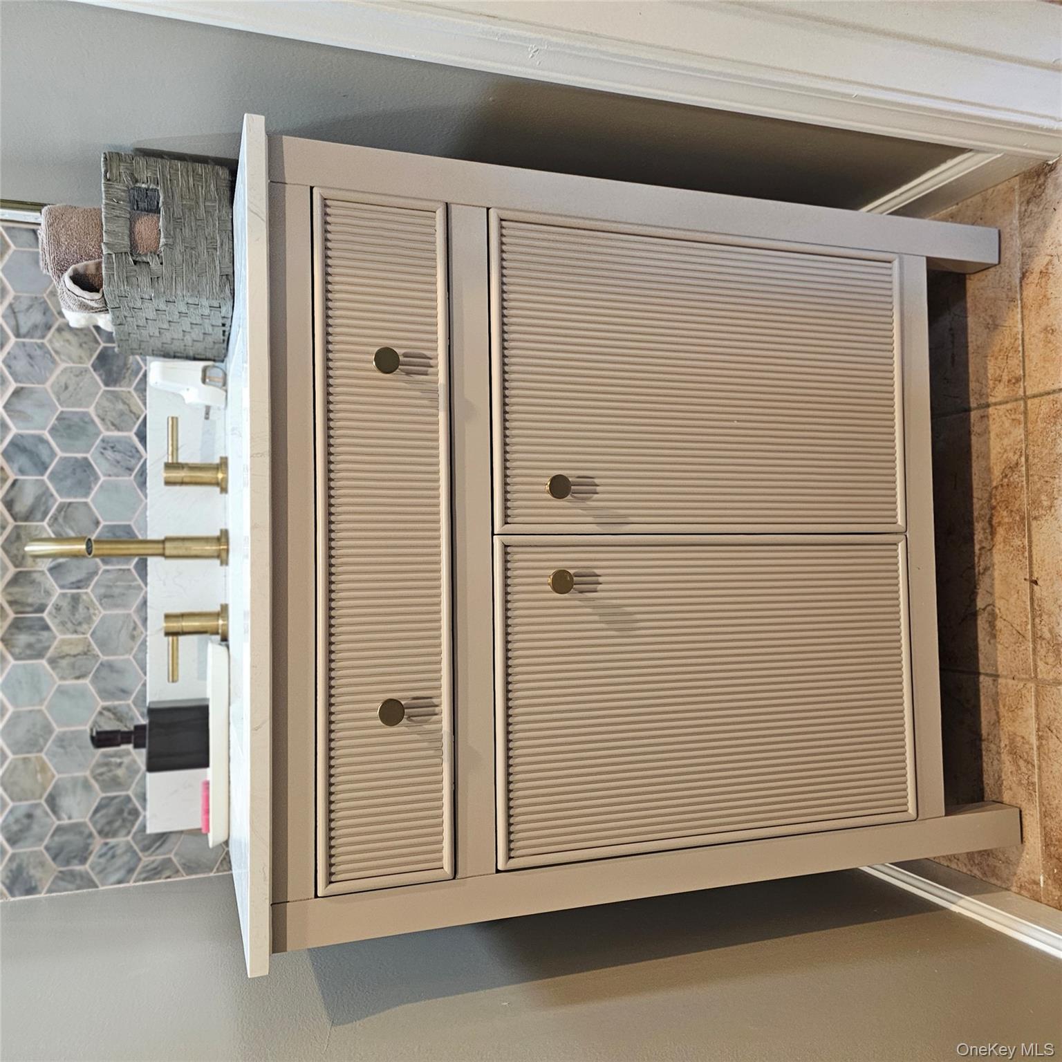235 Maples Road Middletown, NY 10940 - Photo 13 of 34 Bathroom view of vanity and decorative backsplash