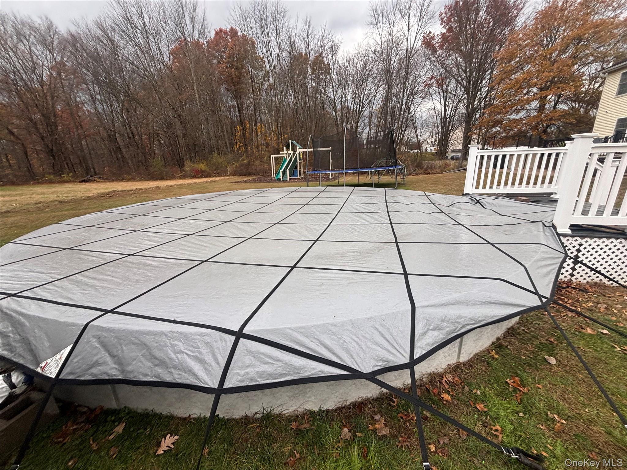 235 Maples Road Middletown, NY 10940 - Photo 29 of 34 View of pool featuring a trampoline, a playground, and a yard