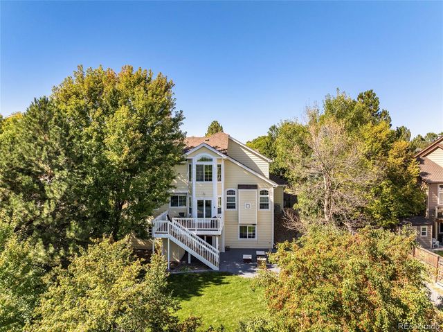 an aerial view of a houses with a yard