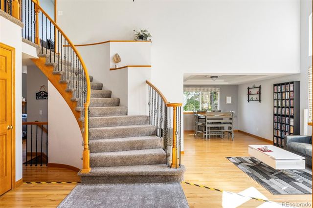 a view of entryway and hall with dining room