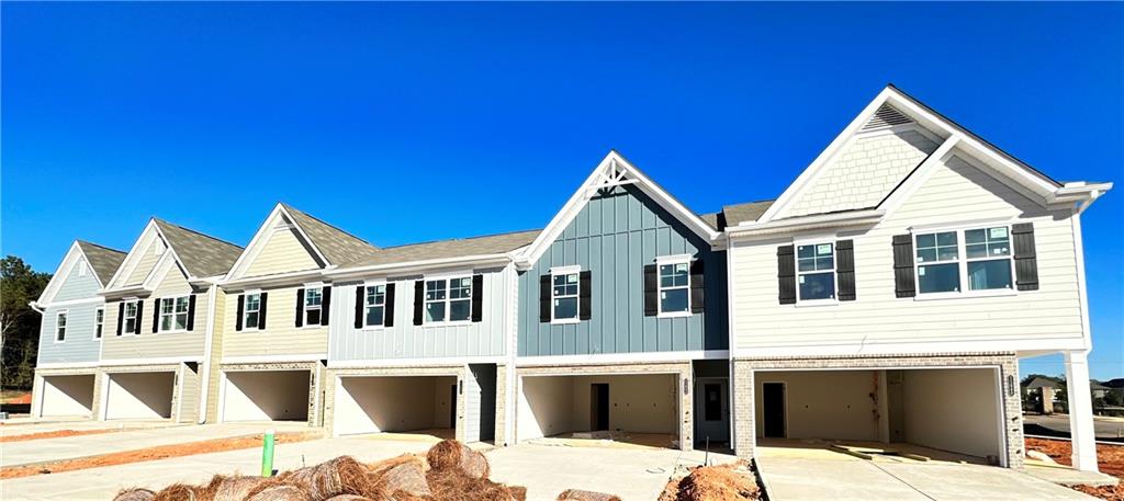 a view of a house with wooden fence