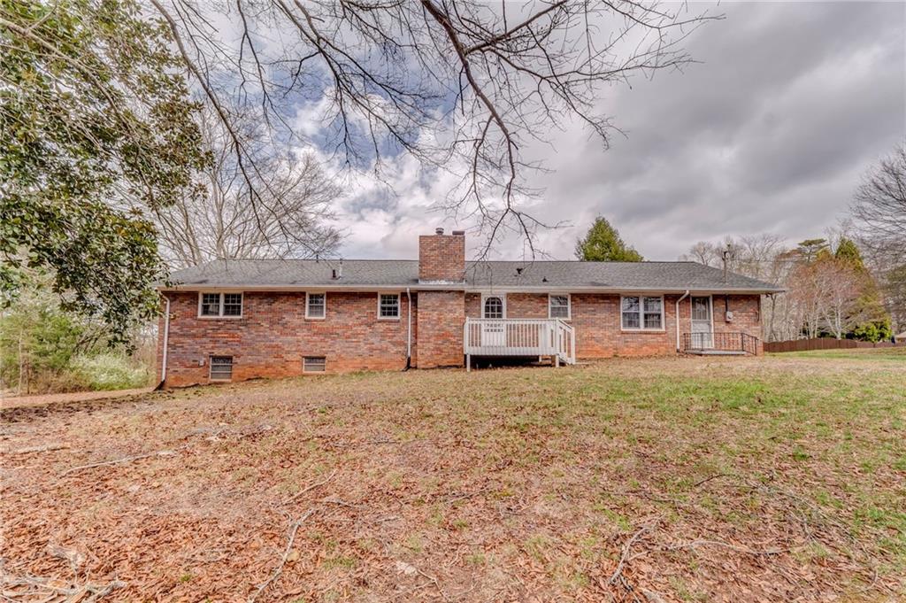 1065 Cartersville Street Ball Ground, GA 30107 - Photo 16 of 51 a house that has a tree in front of it
