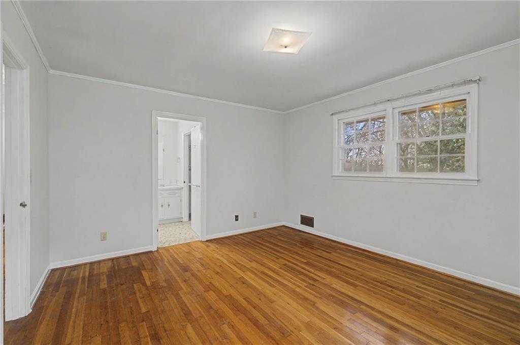 1065 Cartersville Street Ball Ground, GA 30107 - Photo 23 of 51 a view of empty room with wooden floor