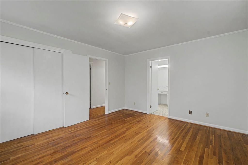 1065 Cartersville Street Ball Ground, GA 30107 - Photo 24 of 51 a view of empty room with wooden floor