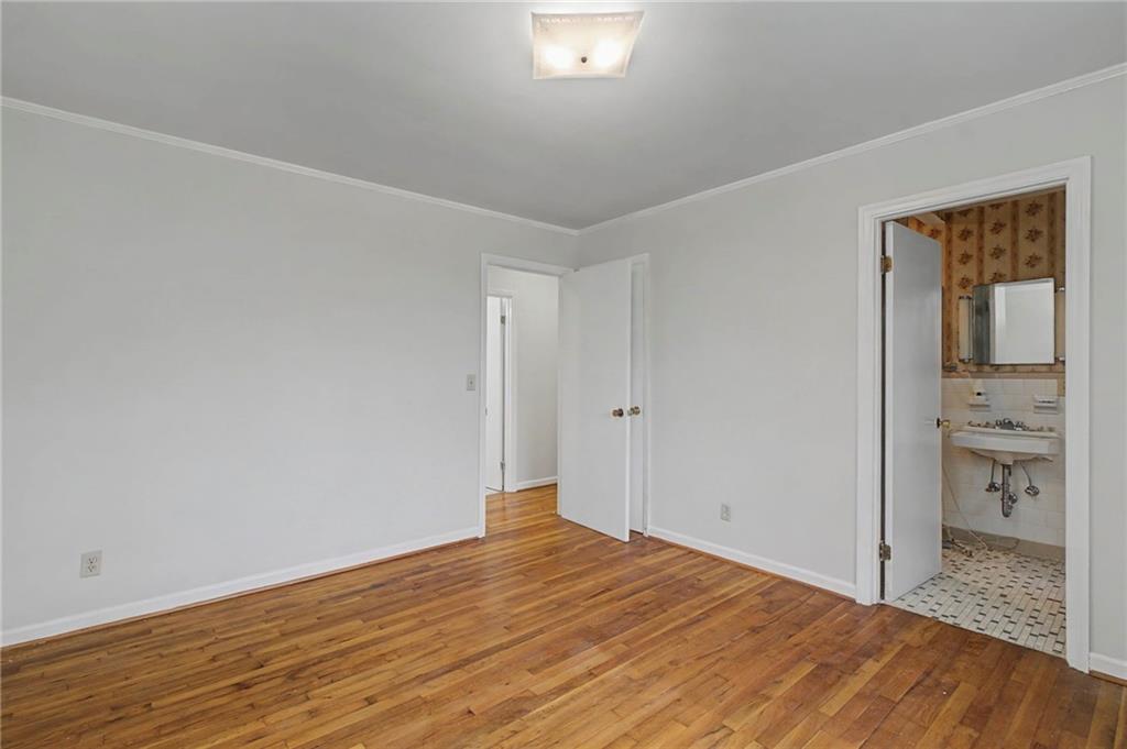 1065 Cartersville Street Ball Ground, GA 30107 - Photo 29 of 51 a room that has a bed in it