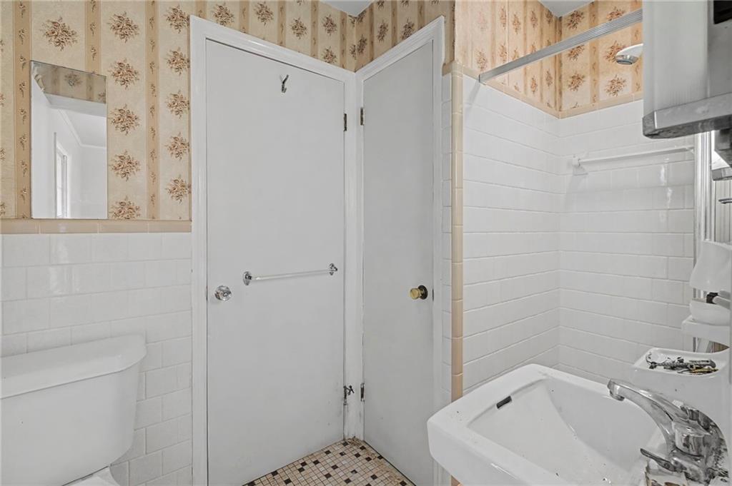 1065 Cartersville Street Ball Ground, GA 30107 - Photo 30 of 51 a bathroom with a sink and shower