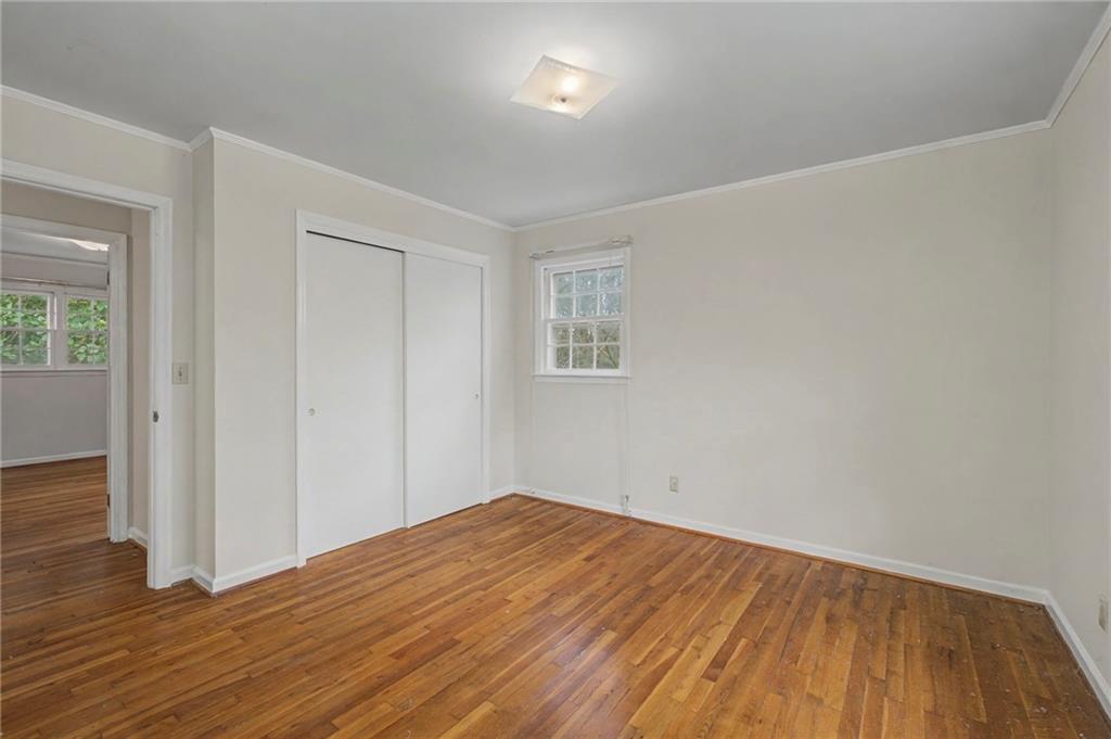 1065 Cartersville Street Ball Ground, GA 30107 - Photo 31 of 51 a view of empty room with wooden floor