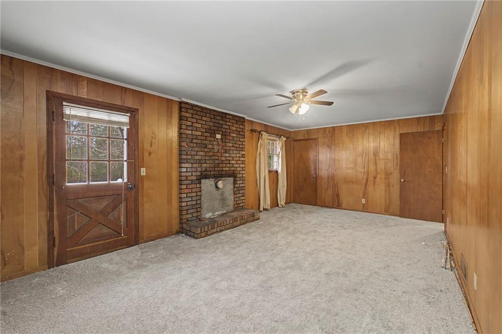 1065 Cartersville Street Ball Ground, GA 30107 - Photo 38 of 51 a view of an empty room with a fireplace