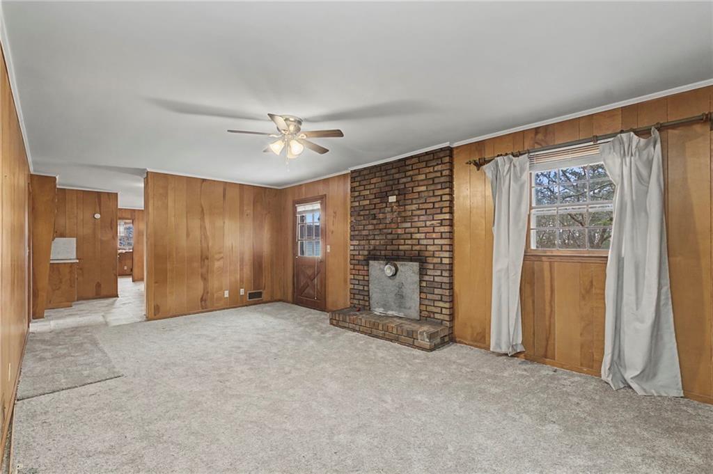 1065 Cartersville Street Ball Ground, GA 30107 - Photo 39 of 51 an empty room with windows and closet area