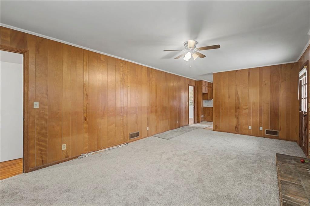 1065 Cartersville Street Ball Ground, GA 30107 - Photo 40 of 51 a view of an empty room with a ceiling fan