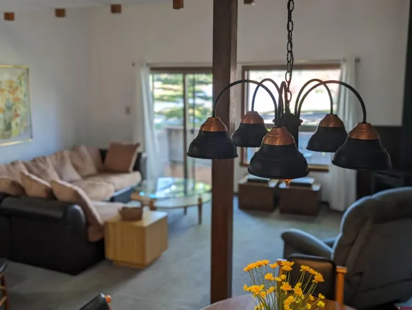 a living room with furniture fireplace and window