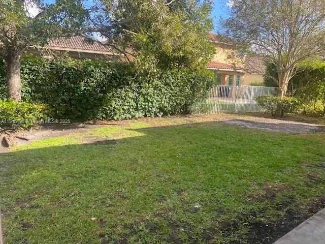 a view of a yard in front of a house