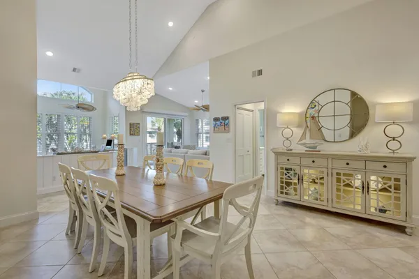 a view of a dining room and chandelier
