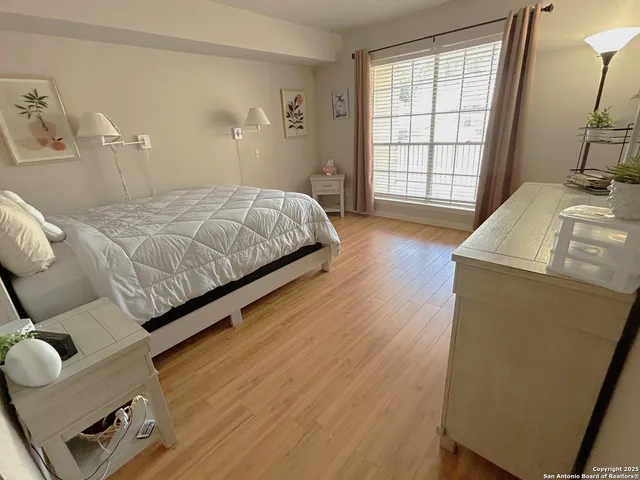 a bedroom with a bed and a table
