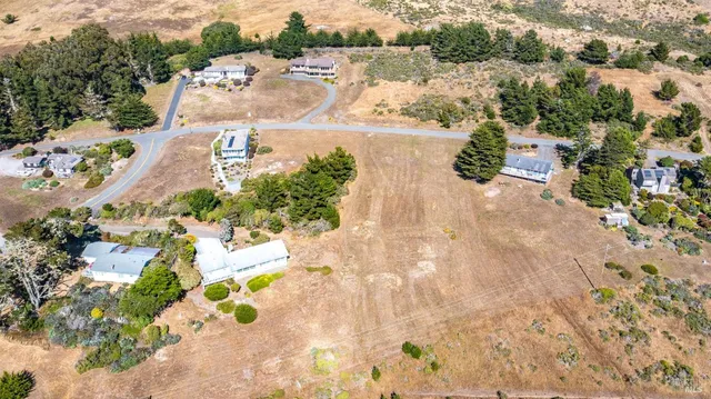 a view of a backyard of a house with a yard