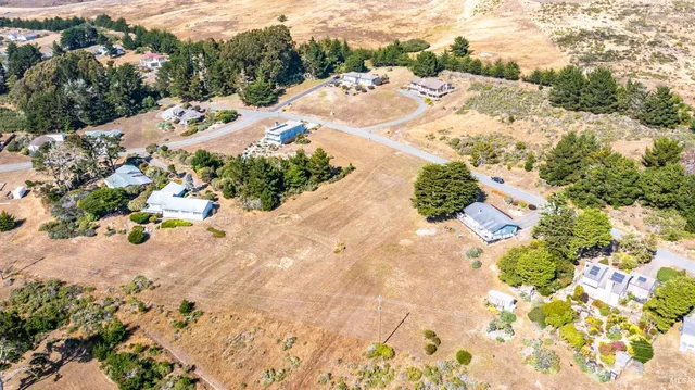 an aerial view of mountain with an outdoor space