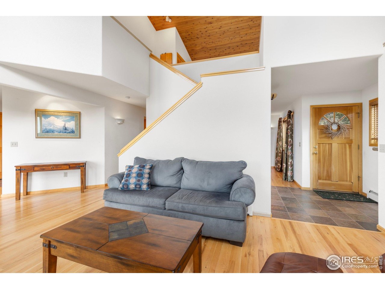 1117 Rock Lake Road Ward, CO 80481 - Photo 17 of 40 a living room with furniture and a wooden floor