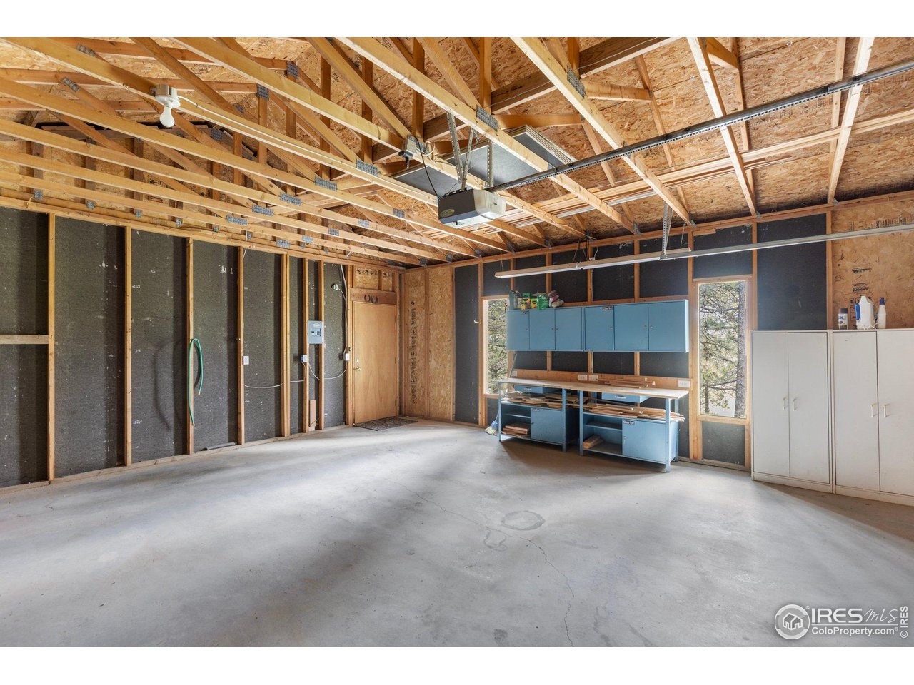 1117 Rock Lake Road Ward, CO 80481 - Photo 34 of 40 a view of a room with wooden walls