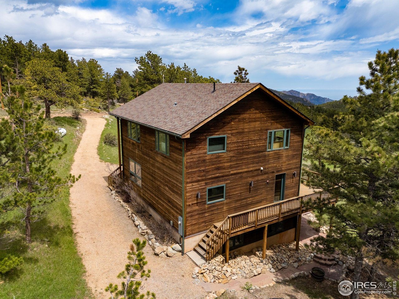 1117 Rock Lake Road Ward, CO 80481 - Photo 37 of 40 a front view of a house with a yard and balcony