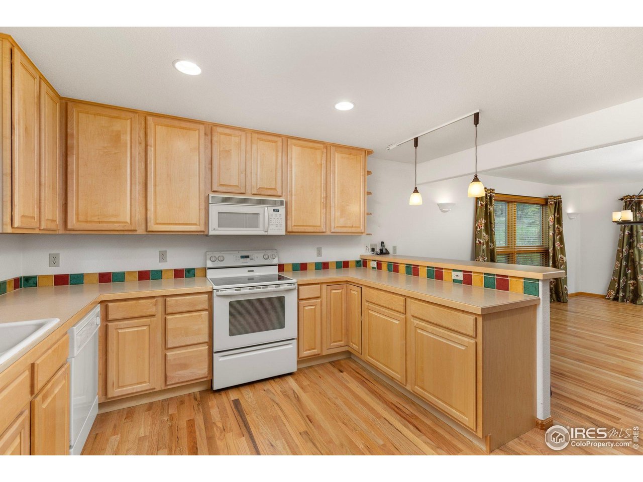1117 Rock Lake Road Ward, CO 80481 - Photo 9 of 40 a kitchen with stainless steel appliances granite countertop a stove and a sink