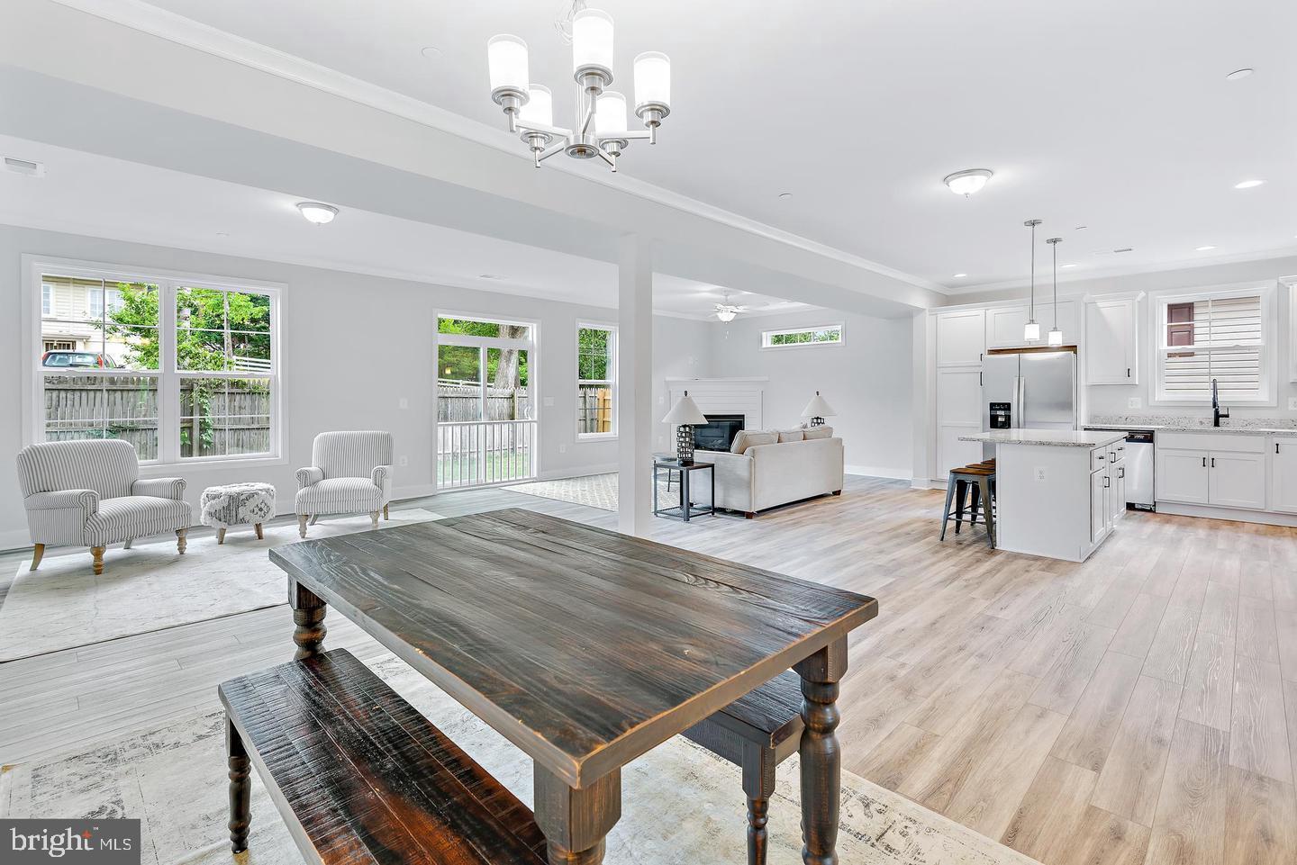 404 Paradise Road Riva, MD 21140 - Photo 20 of 51 a living room with furniture dining table and a large window