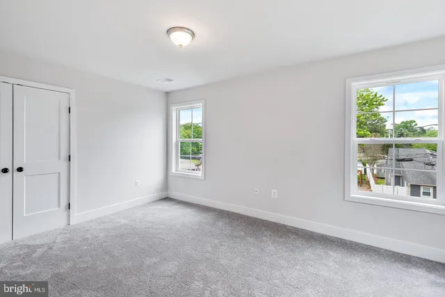 an empty room with windows